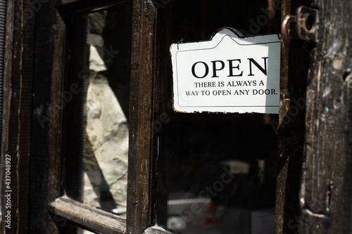 Open shop sign thats hangs on the door