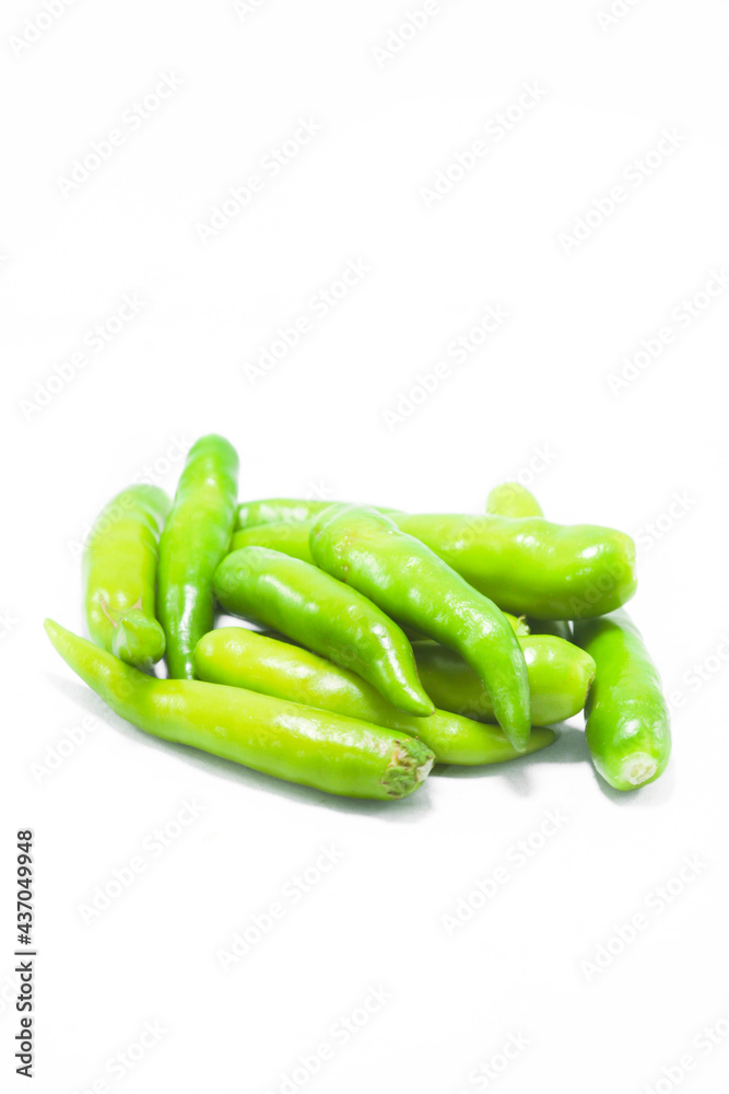 Fresh large green chillies cultivated by farmers for sale and self-eating - for seasoning and appetizing food on a white background with local hot letters. Fresh large green chillies cultivated by farmers for sale and self-eating - for seasoning and appetizing food on a white background with local hot letters.