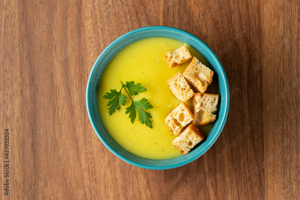Bowl with onion soup and croutons on the table. Bowl with onion soup and croutons on the table.