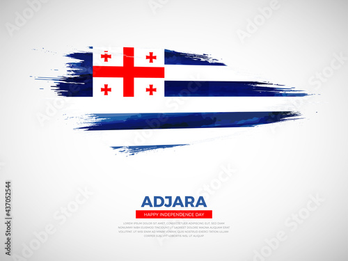 Grunge style brush painted Adjara country flag illustration with national day typography