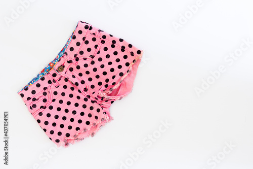 top view of summer women shorts on white background. summer fashion concept. flat lay
