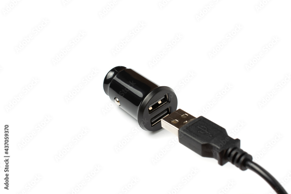 USB wire and black car charger with two USB ports, multifunctional cigarette lighter adapter plug. white background. USB wire and black car charger with two USB ports, multifunctional cigarette lighter adapter plug. white background.