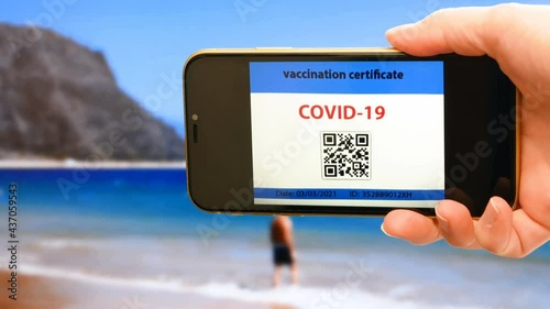 Vaccination passport on a mobile phone allowing travel in hand. Vaccination against the coronavirus Covid 19.Imunity or Health passport, closeup photo