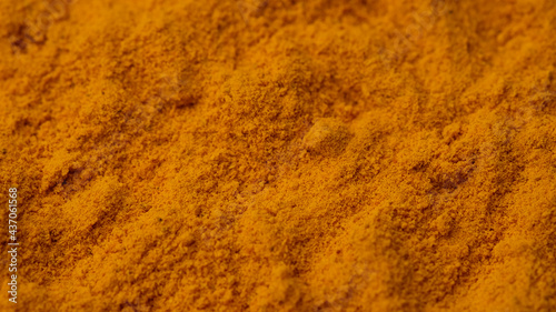 turmeric powder top view. Condiment or dietary supplement. 
