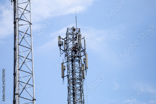 transmitter atop a cell phone pole About to be upgraded from 4g to 5g. High-risk electrical engineer job in Thailand.