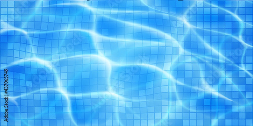 Swimming pool background with mosaic tiles, sunlight glares and caustic ripples. Top view of the water surface. In blue colors
