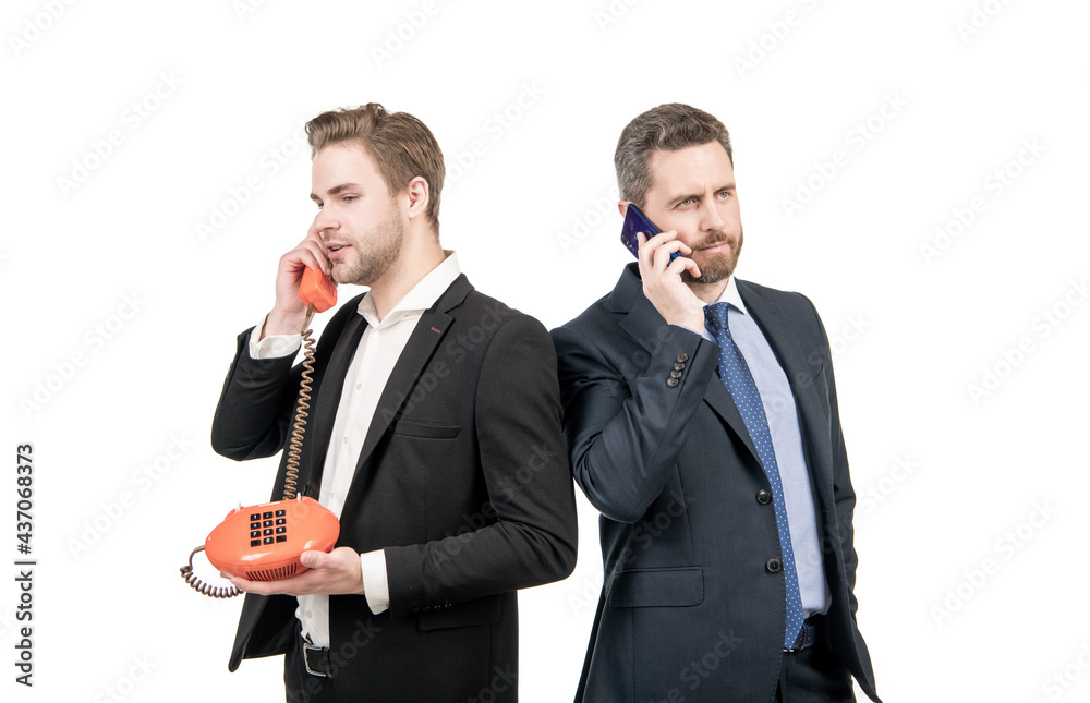Whos calling. Businessmen got call. Businessmen talk on mobile phone and telephone. Technology progress Whos calling. Businessmen got call. Businessmen talk on mobile phone and telephone. Technology progress