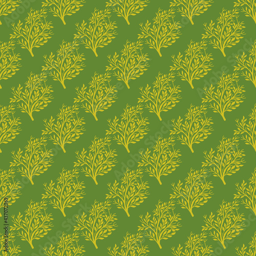 Creative yellow tree forest seamless doodle pattern in hand drawn floral style. Green background. Nature shapes.