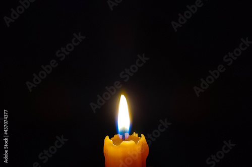 Candle on a black background,Candle, Flame, Candlelight, Dark, Candle light in the dark,Candle flame close up.