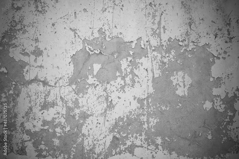 old rough gray cement wall surface for the background. Peeling wall surface with cracks and scratches. The Walls and backgrounds Old cement walls with black stains on the surface caused by moisture.