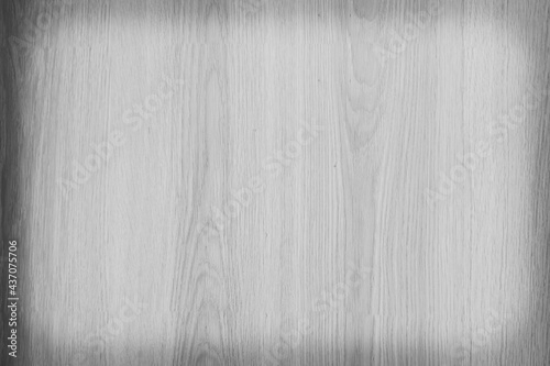 Old plywood surface made into a black and white image. The softness of the ply stripes plywood surface for the background. Black and white background of old plywood texture.
