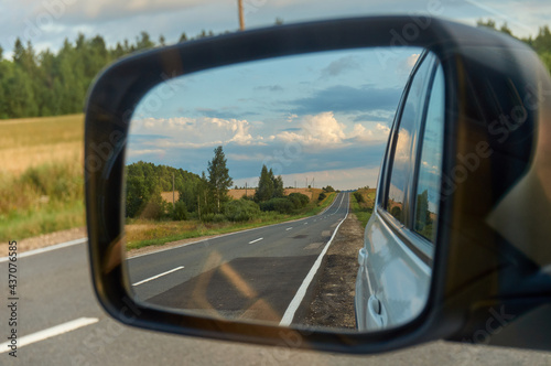 view in the side mirror of the car