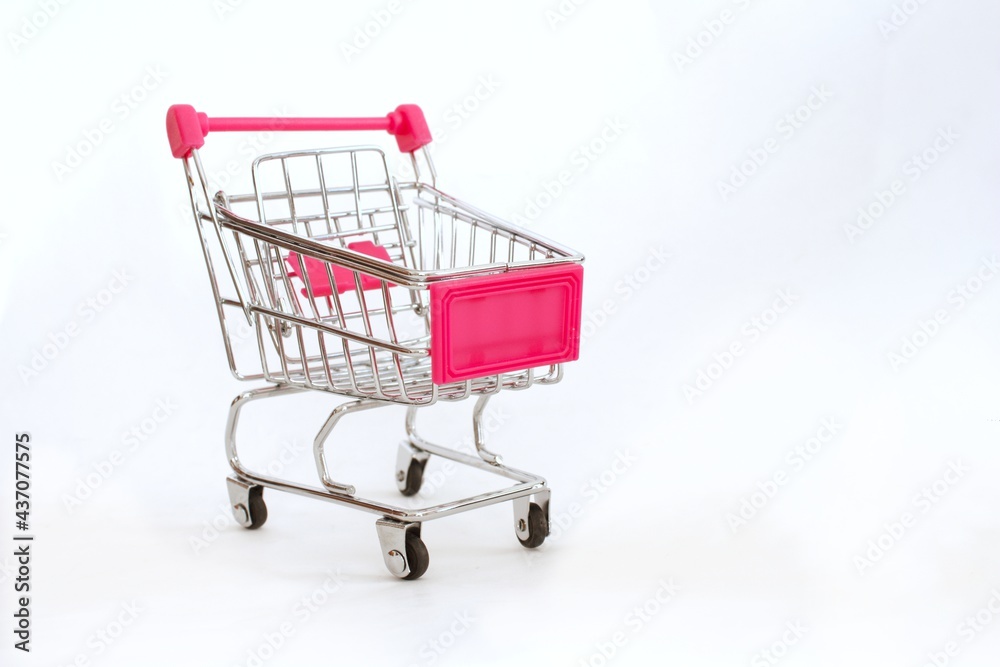 Mini shopping cart or trolley isolated on white background with copy space. Mini shopping cart or trolley isolated on white background with copy space.
