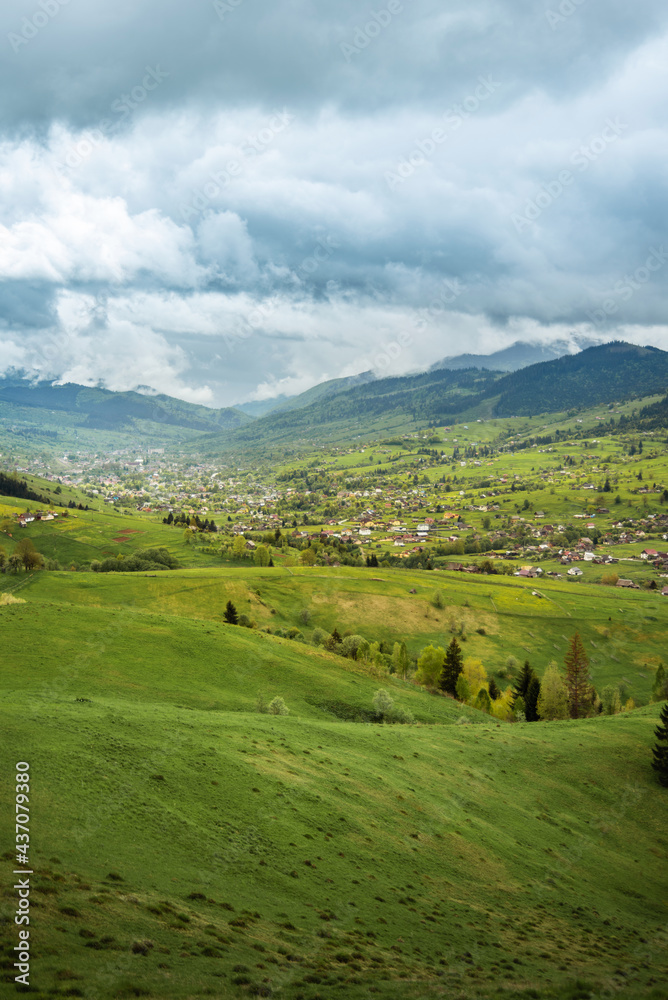 amazing spring (summer) mountain landscape. blue dramatic cloudy sky. natural background