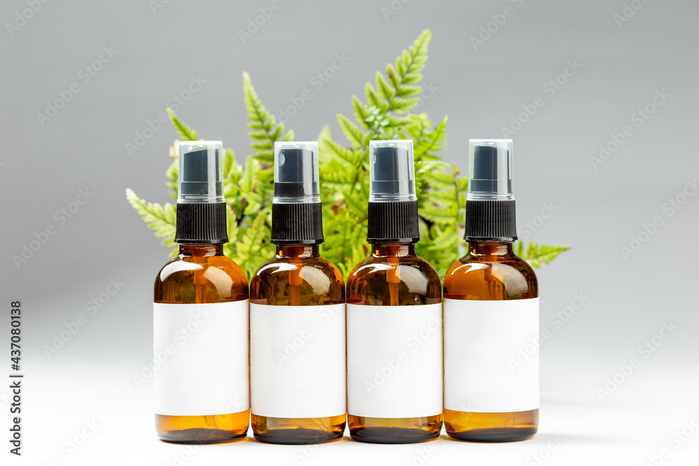 Dark glass spray bottles with white labels Dark glass spray bottles with white labels