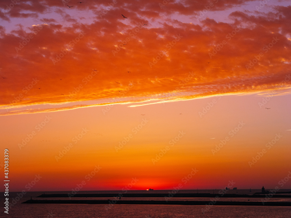 Background texture of beautiful orange and blue sunset sky with clouds 