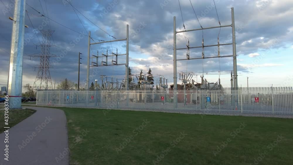 High-power electricity transmission station at sunset. A part of an electrical generation, transmission, and distribution system. High-power electricity transmission station at sunset. A part of an electrical generation, transmission, and distribution system.