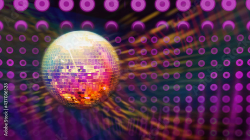 Sparkling disco ball with bright rays over dark night club interior background. Night party background. Music dance design for advertise. Dance night party background. Flyer or poster design promo.