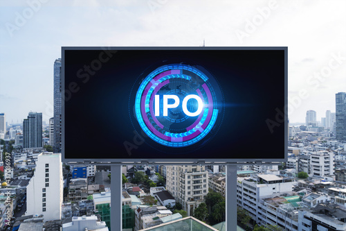 IPO icon hologram on road billboard over day time panorama city view of Bangkok. The hub of initial public offering in Southeast Asia. The concept of exceeding business opportunities.