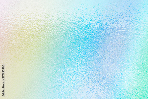 Waterdrops on blue purple green Rainbow gradient background. Rainbow background with soft light watercolor colors. High quality photo