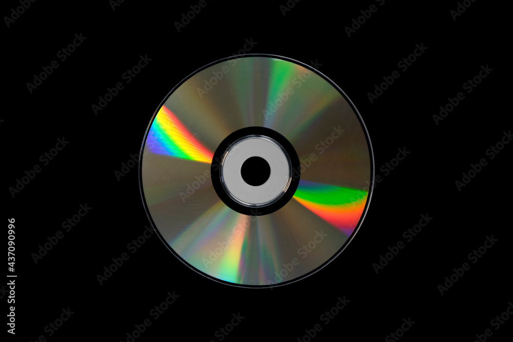 cd or dvd, storage data information technology. music and movie record. holographic side of the compact disc. a compact disc isolated on black background. cd or dvd, storage data information technology. music and movie record. holographic side of the compact disc. a compact disc isolated on black background.