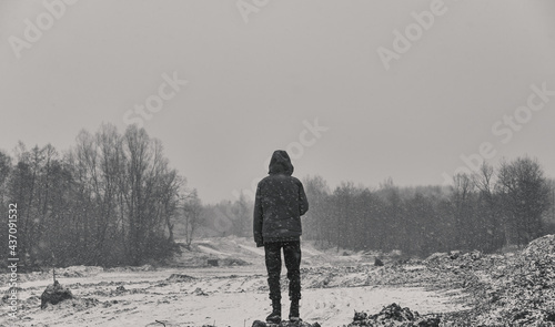 Man on the mountain. Black and white photo. Winter. Big beautiful snowfall.