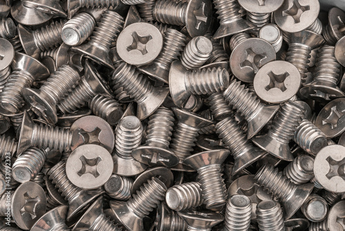 Stainless steel phillips flat head screws. Macro photo high resolution close up photo.