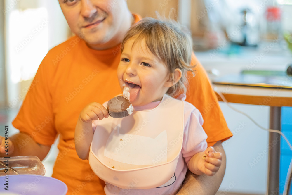 baby try ice cream first time. toddler lick ice cream with happy emotion. tasty sweet food baby try ice cream first time. toddler lick ice cream with happy emotion. tasty sweet food