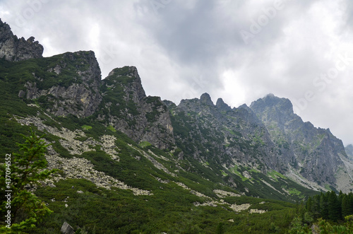 Scenic view of sharp rocky mountains covered with clouds in High Tatras, Slovakia 