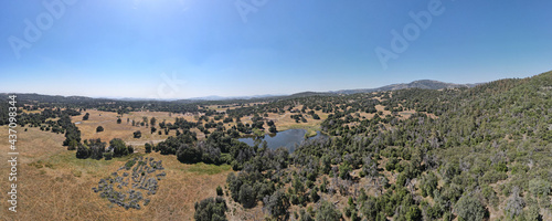 Aerial view of small lake in the valley, between farmland and forest in the town of Julian, east of San Diego, California, USA photo