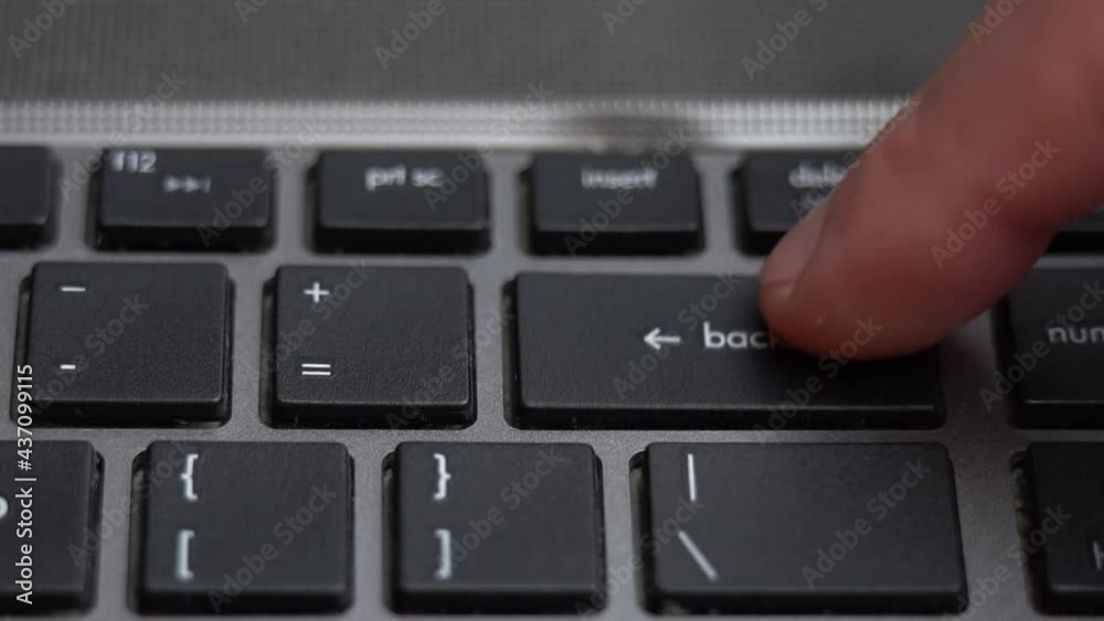 Backspace button pressing a lot of times on keyboard, laptop keyboard close up