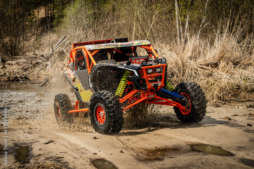 Fast ATV and UTV driving in mud and water. Quad racing, ATV 4x4. Fast ATV and UTV driving in mud and water. Quad racing, ATV 4x4.