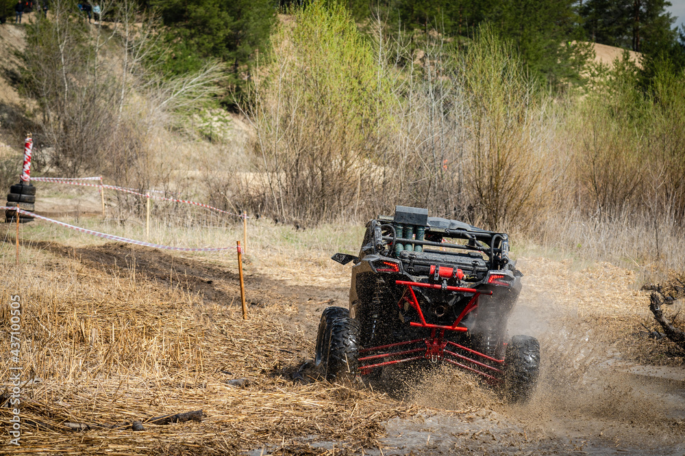Offroad vehicle in the action and makes splashes of dirty water Offroad vehicle in the action and makes splashes of dirty water