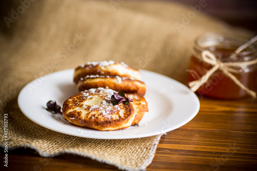 sweet fried cottage cheese pancakes in a plate