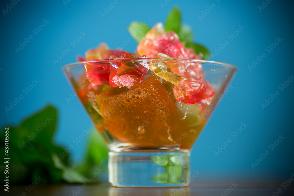 colored sweet fruit jelly in a glass glass colored sweet fruit jelly in a glass glass