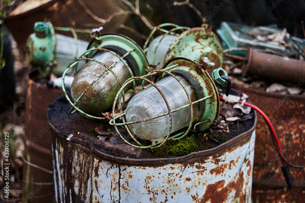 Old rusty lamps in the garbage 