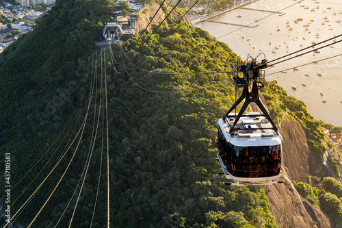 Sugar Loaf Hill and the cable car going up in the late afternoon in Rio de Janeiro