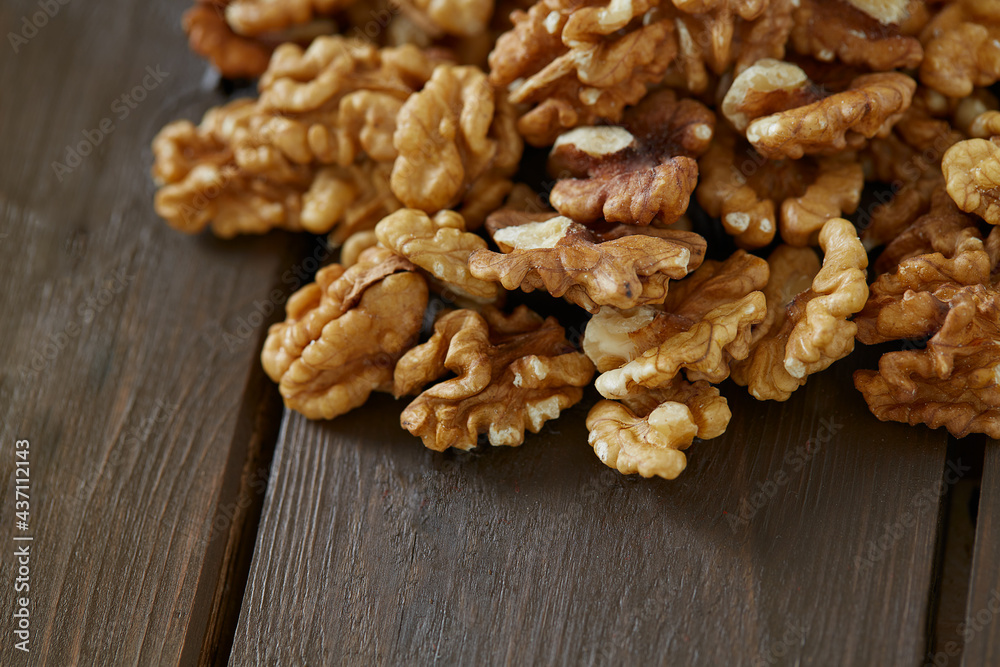 walnuts on wooden surface walnuts on wooden surface