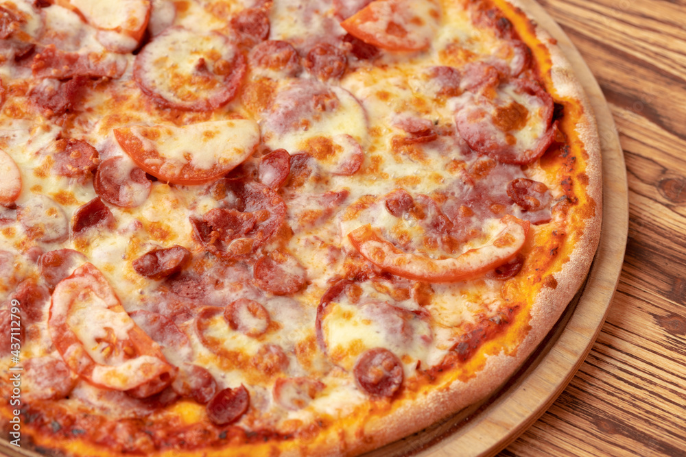 Freshly baked pizza on table close up