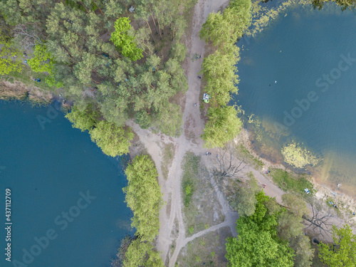 Lake in the park in spring. Aerial drone view.