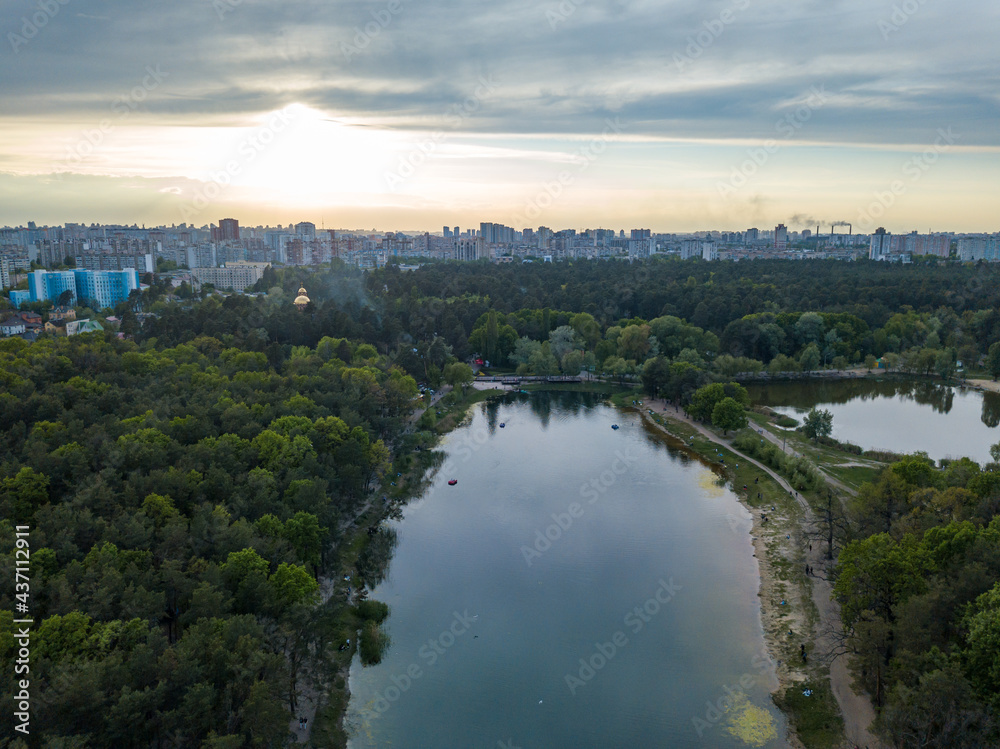Lake in the park in spring. Aerial drone view.