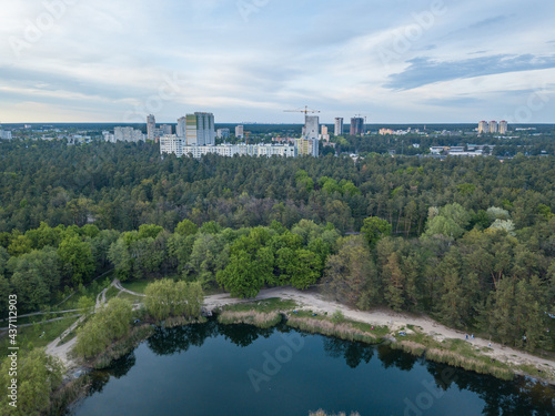 Lake in the park in spring. Aerial drone view.