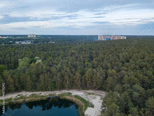 Lake in the park in spring. Aerial drone view.