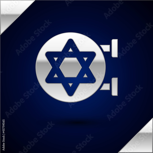Silver Jewish synagogue building or jewish temple icon isolated on dark blue background. Hebrew or judaism construction with David star. Vector