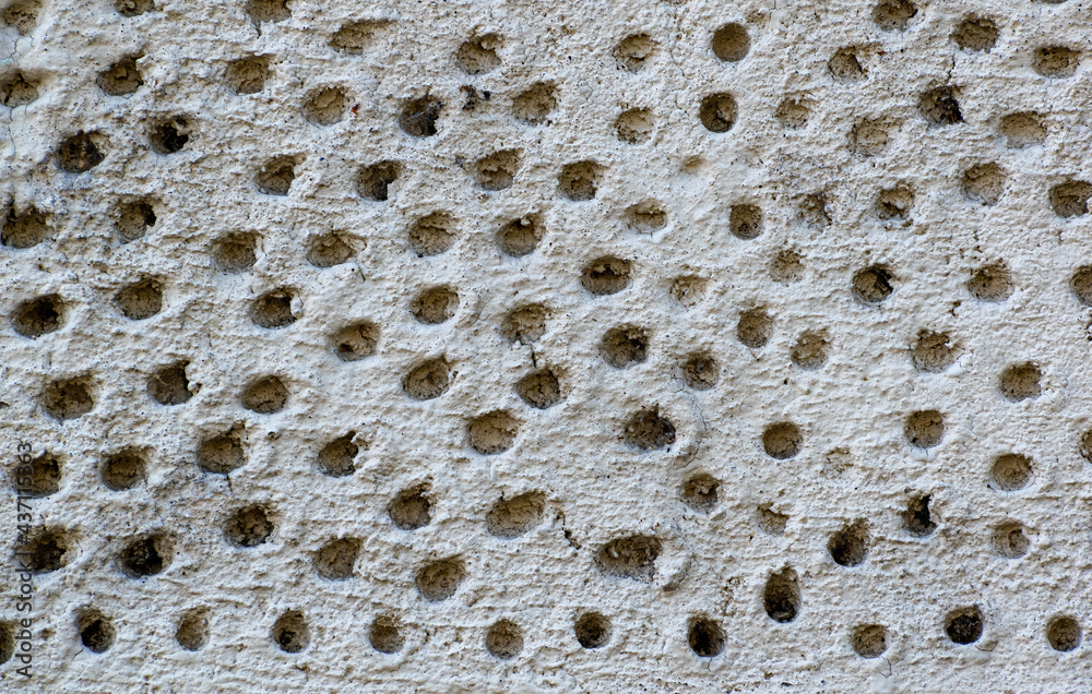 Surface texture background in gray with many holes Surface texture background in gray with many holes