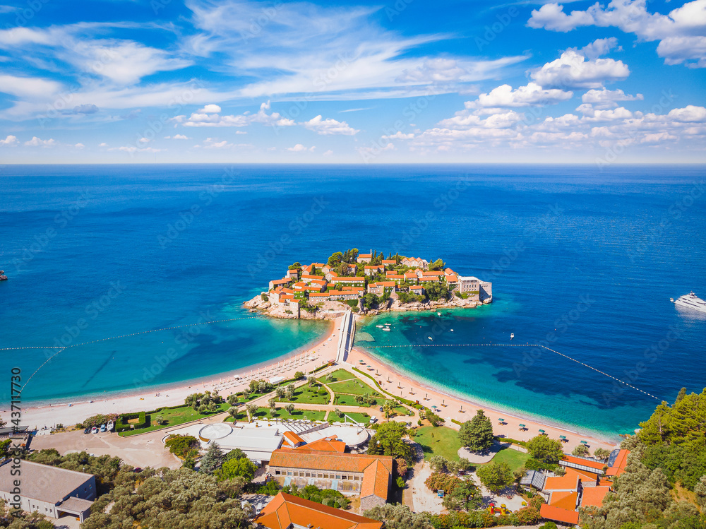 Famous Sveti Stefan island in Budva during a summer day, Montenegro. Drone aerial photo