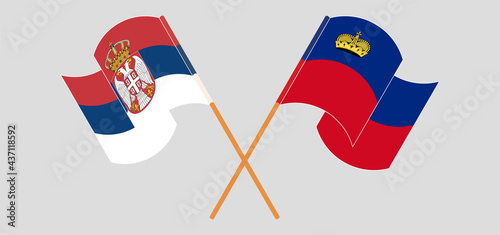 Crossed and waving flags of Serbia and Liechtenstein