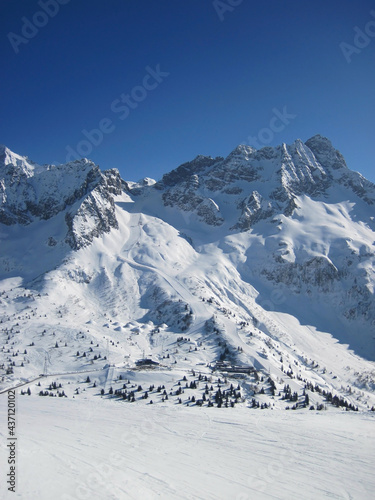 Snowy mountain peaks in sunny weather