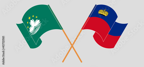 Crossed and waving flags of Macau and Liechtenstein