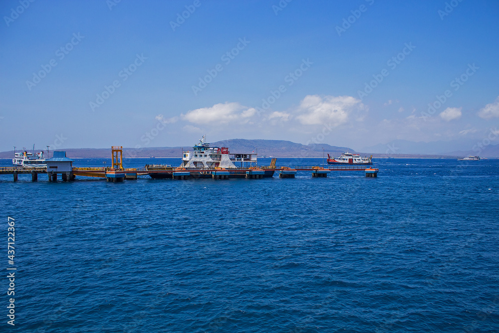Ferries and boats sailing up and down the sea channel between Bali and Java islands, from Ketapang port to Gilimanuk port, Indonesia
